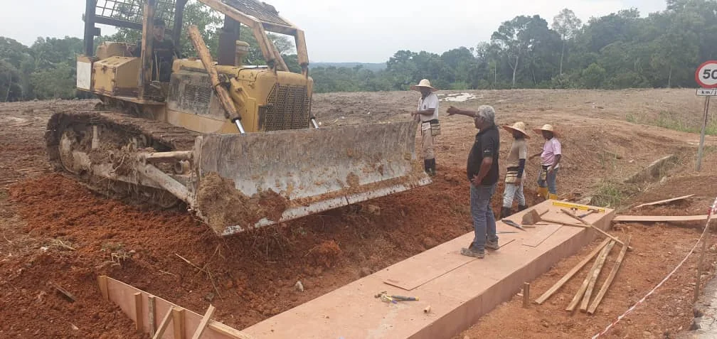 Formwork for a concrete drain beside the earthworks